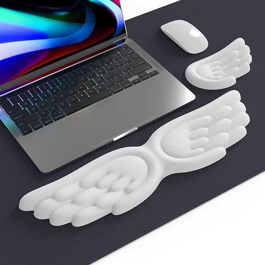 Angel-Wing ergonomic keyboard and mouse wrist rest set in white with keyboard and mouse on dark desk